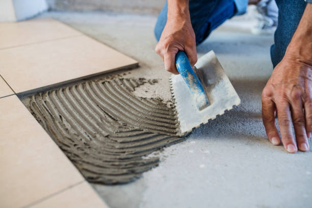 Unrecognizable old man working on interior of new house or flat.